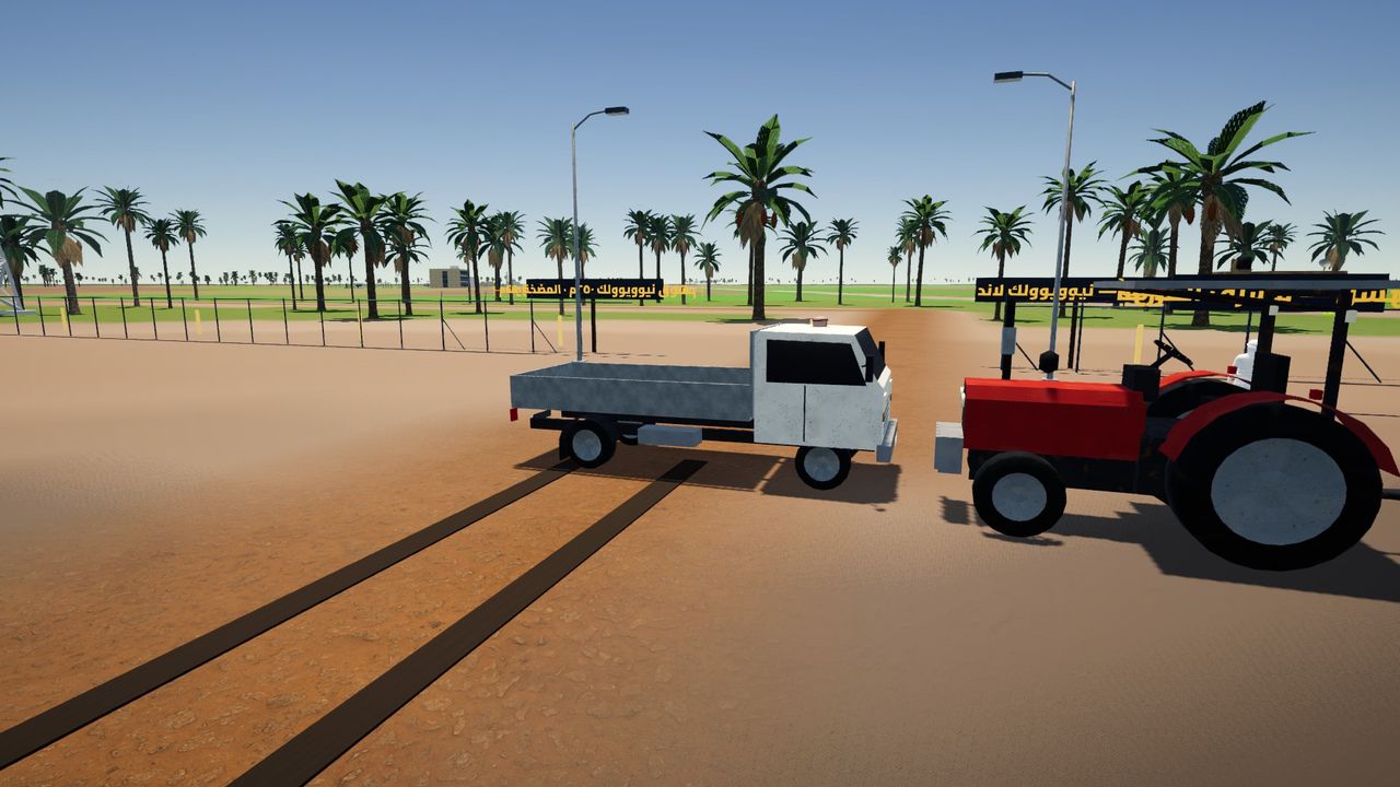 شاحنة خفيفة وتراكتور بالمزرعة